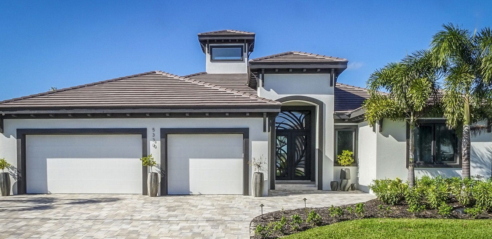 The Necker Island custom home front elevation by Koogler Homes, Cape Coral, FL